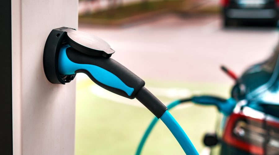 Electric vehicle charging station point, closeup of unit plug